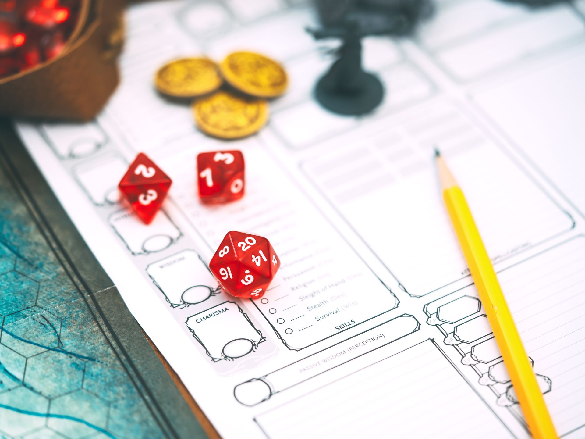 Three dice and a pencil lay on a D&D character sheet