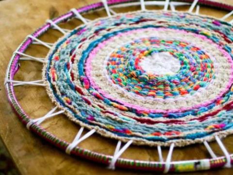 Hulu hoop with yarn weaved to create a rug