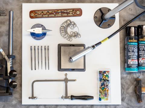 An assortment of tools and jewelry projects