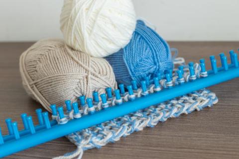 large knitting loom and yarn