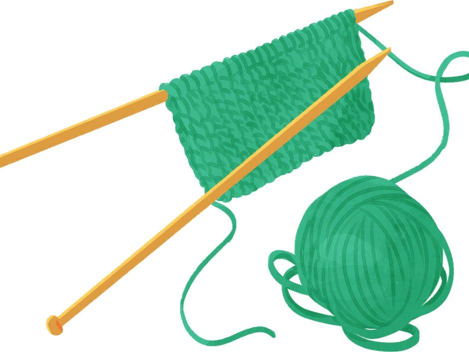 green yarn and knitting needles 