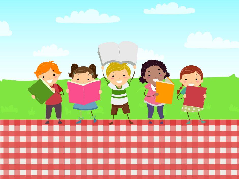 Kids holding books outside on picnic blanket